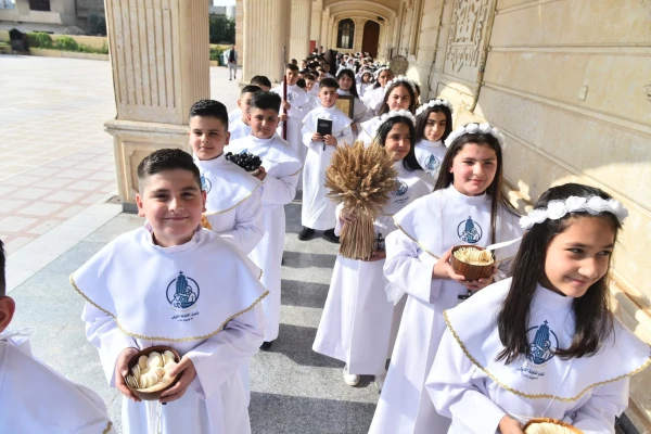 Children process into a church in Qaraqosh, Iraq, to celebrate their first holy Communion. Over 450 boys and girls received the sacrament during liturgies held over the past month in various churches of the town. Credit: Syriac Catholic Archdiocese of Mosul, Iraq