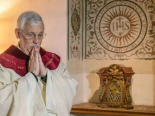 Father Arturo Sosa, superior general of the Society of Jesus, prepares to celebrate Mass at the Gesu in Rome on Oct. 15, 2016.