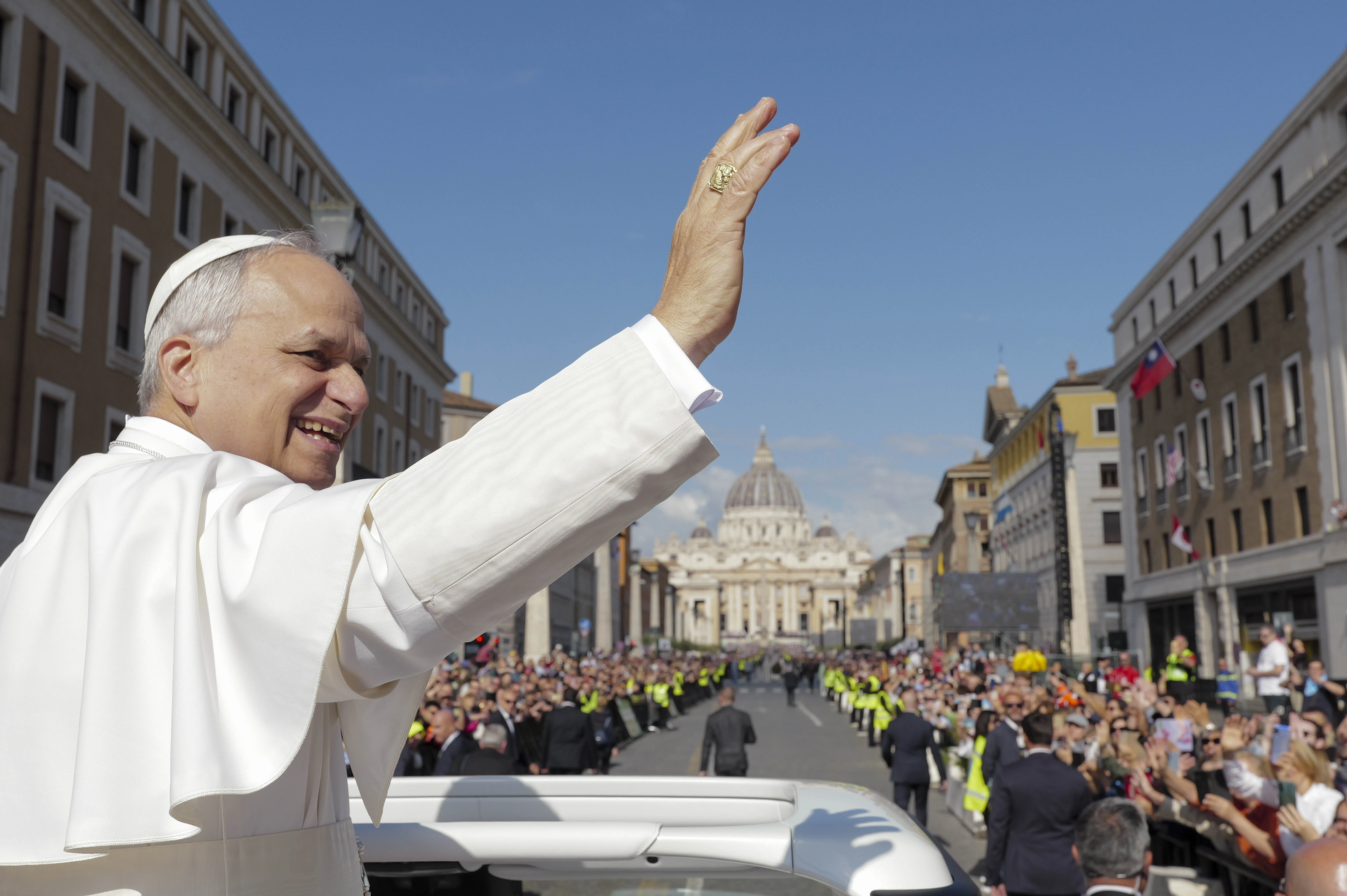 From the popemobile, Pope Leo XIV greets thousands of people lined up along Via della Conciliazione on the morning of his inaugural Mass, Sunday, May 18, 2025.?w=200&h=150