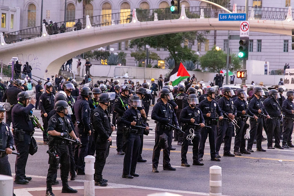 LAPD rally as a curfew takes effect in Los Angeles on June 10, 2025, following days of protests in response to federal immigration operations that saw clashes spread across downtown.?w=200&h=150
