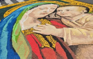 The Via della Conciliazione, the grand avenue leading to St. Peter’s Square in Rome, was transformed this Sunday into a vibrant tapestry of color laid over the asphalt, June 29, 2025. Credit: Hannah Brockhaus