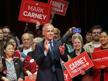 Canada’s prime minister and Liberal Party leader Mark Carney applauds at a victory party in Ottawa, Ontario, on April 29, 2025. Prime Minister Mark Carney won Canada’s election on April 28, 2025, leading his Liberal Party to a new term in power.