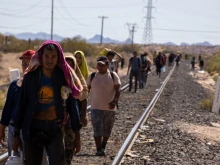 Migrants walk alongside the railroad tracks after dismounting from the “La Bestia” train, which they rode through Mexico to reach the Mexico-U.S. border near Chihuahua, Mexico.