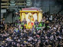 The miraculous image of Jesus Nazareno makes its way through the streets of Manila surrounded by thousands of devotees during the Traslacion procession celebrated annually on Jan. 9.