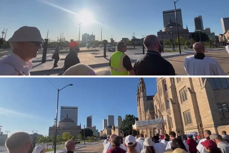 Stills from a video shared with EWTN News and taken by the pilgrims on May 30, 2025, while the procession was in the Diocese of Tulsa, Oklahoma, show Catholic participants in the procession walking and singing while a young man on the sidelines, speaking through a bullhorn and walking alongside the crowd, deplores Eucharistic devotion as “idolatry.”?w=200&h=150