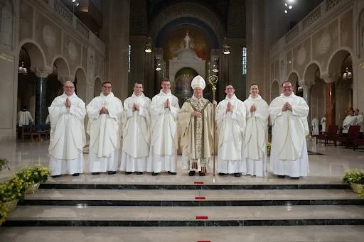 Seven Dominican brothers were ordained to the priesthood by Archbishop Anthony Fisher, OP, who leads the Archdiocese of Sydney, Australia. The newest Dominican priests are Louis Mary Bethea, Gregory Marie Santy, Bertrand Marie Hebert, Basil Mary Burroughs, Titus Mary Sanchez, Nicodemus Maria Thomas, and Linus Mary Martz, pictured here with the archbishop at their ordination at the the Basilica of the National Shrine of the Immaculate Conception in Washington, D.C., on June 4, 2025.?w=200&h=150