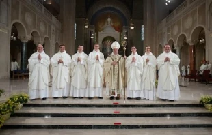 Seven Dominican brothers were ordained to the priesthood by Archbishop Anthony Fisher, OP, who leads the Archdiocese of Sydney, Australia. The newest Dominican priests are Louis Mary Bethea, Gregory Marie Santy, Bertrand Marie Hebert, Basil Mary Burroughs, Titus Mary Sanchez, Nicodemus Maria Thomas, and Linus Mary Martz, pictured here with the archbishop at their ordination at the the Basilica of the National Shrine of the Immaculate Conception in Washington, D.C., on June 4, 2025. Credit: Jeffrey Bruno