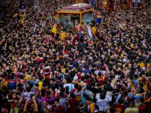 Filipino Catholic devotees jostle one another to touch the Black Nazarene during its annual procession on Jan. 9, 2025, in Manila, Philippines. The feast of the Black Nazarene is attended by millions of barefoot devotees and happens every Jan. 9.