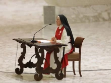 Cloistered monastic nun Sister Maria Gloria Riva of the Nuns of Perpetual Adoration of the Blessed Sacrament addresses Pope Leo XIV, cardinals, bishops, and other employees at the Vatican for the Jubilee of the Holy See on June 9, 2025.