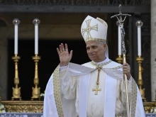 Pope Leo XIV waves to those gathered for Mass on the solemnity of Corpus Christi on Sunday, June 22, 2025, in Rome.