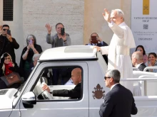 Pope Leo XIV greets crowds in St. Peter’s Square from the popemobile on Sunday, May 18, 2025.