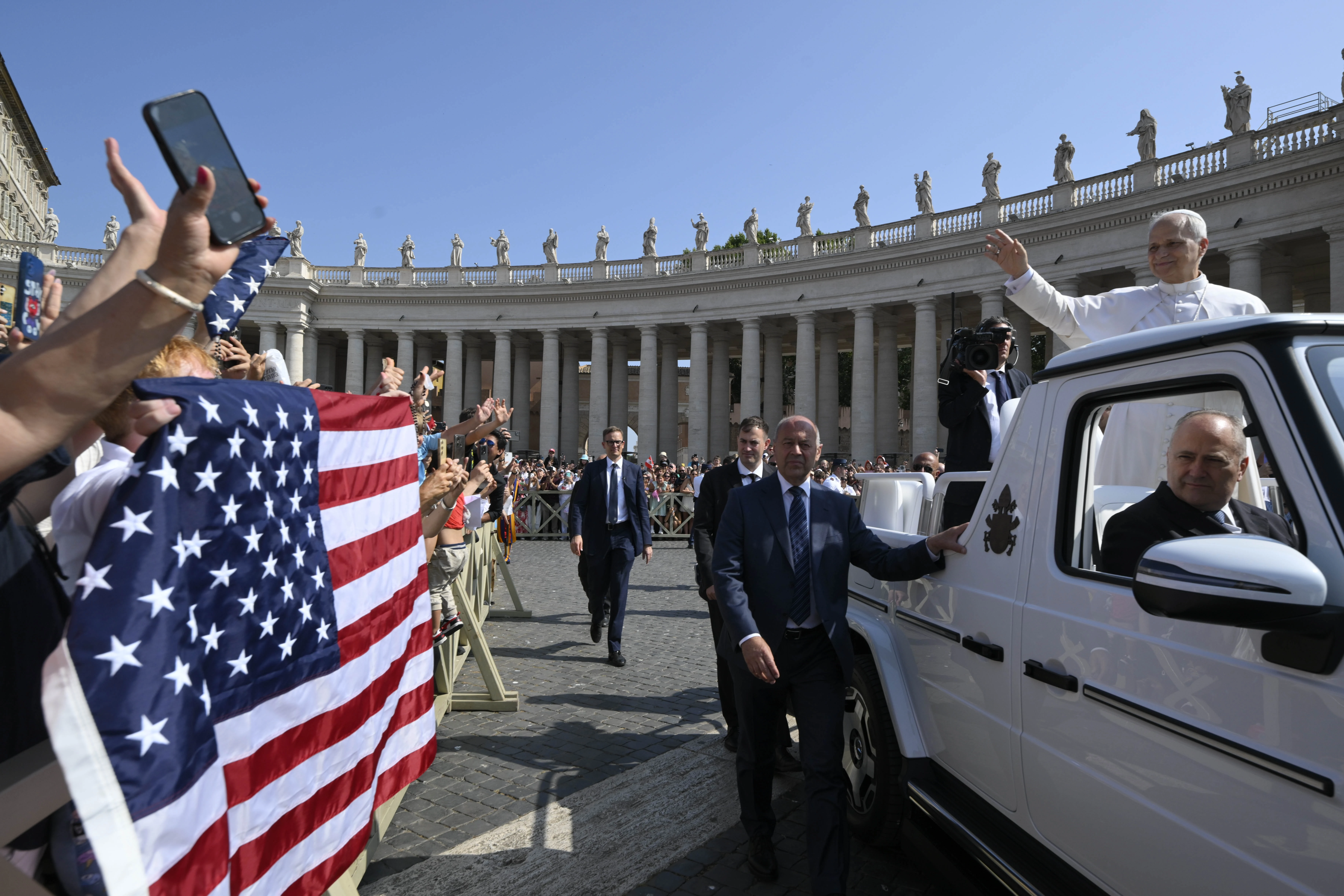 Pope Leo XIV waves as the popemobile passes by a crowd of American pilgrims gathered in St. Peter’s Square for the pope’s general audience on June 18, 2025, at the Vatican.?w=200&h=150