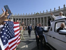 Pope Leo XIV waves as the popemobile passes by a crowd of American pilgrims gathered in St. Peter’s Square for the pope’s general audience on June 18, 2025, at the Vatican.