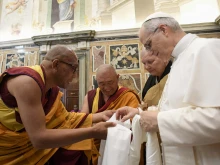 Pope Leo XIV greets Buddhist monks in a meeting with representatives of other Christian churches, ecclessial communities, and other religions on May 19, 2025, at the Vatican.