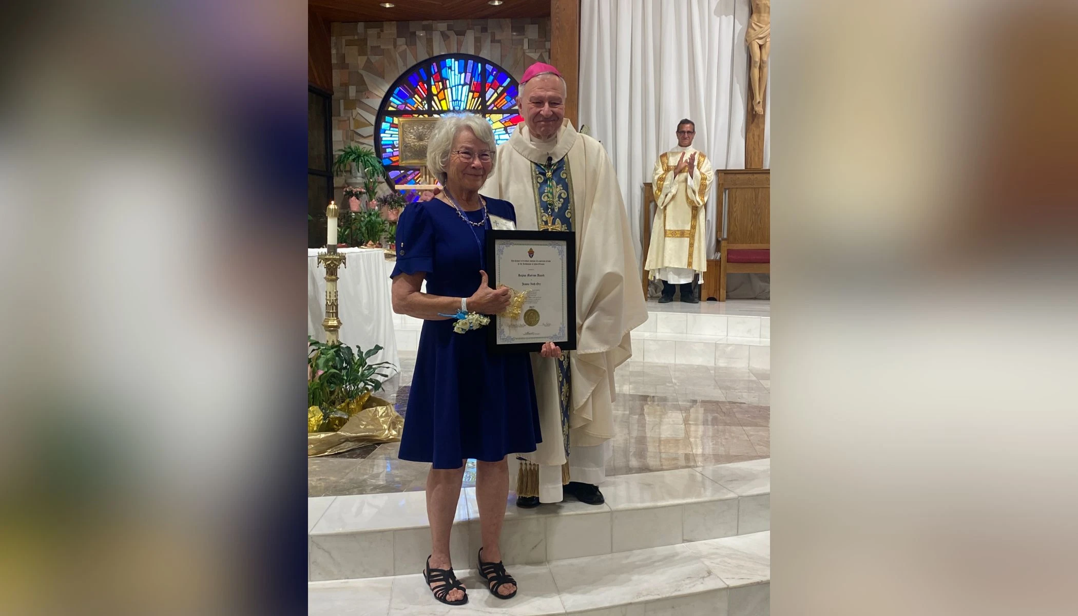 Jeanne Vath Ory receives her Regina Matrum Award after a special vigil Mass was celebrated by New Orleans Archbishop Gregory Aymond at her home parish, St. Joan of Arc in LaPlace, Louisiana, on May 12, 2025, the day after Mother’s Day.?w=200&h=150