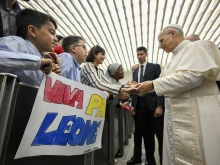 Pope Leo XIV meets employees of the Holy See and their families in the Paul VI Hall at the Vatican on Saturday, May 24, 2025.