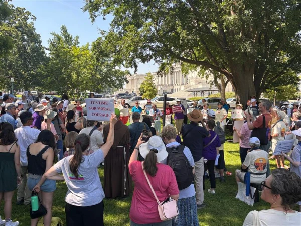 Religious sisters from 60 communities as well as other supporters gather on the Senate lawn for the "Sisters Speak Out" prayer and public witness event to urge lawmakers not to cut government programs that support immigrants and people with low incomes. Credit: Julia Morris