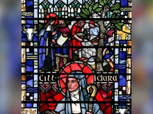 St. Brigid of Kildare building the Church of the Oak, detail from a window of St. Etheldreda’s Church in London.