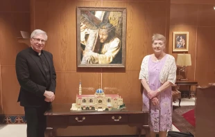 Monsignor Vito Buonanno and Dee Steel pose before the Lego model of the Basilica of the National Shrine of the Immaculate Conception in Washington, D.C., Tuesday, June 24, 2025. Credit: Paris Apodaca/CNA