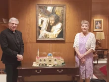 Monsignor Vito Buonanno and Dee Steel pose before the Lego model of the Basilica of the National Shrine of the Immaculate Conception in Washington, D.C., Tuesday, June 24, 2025.