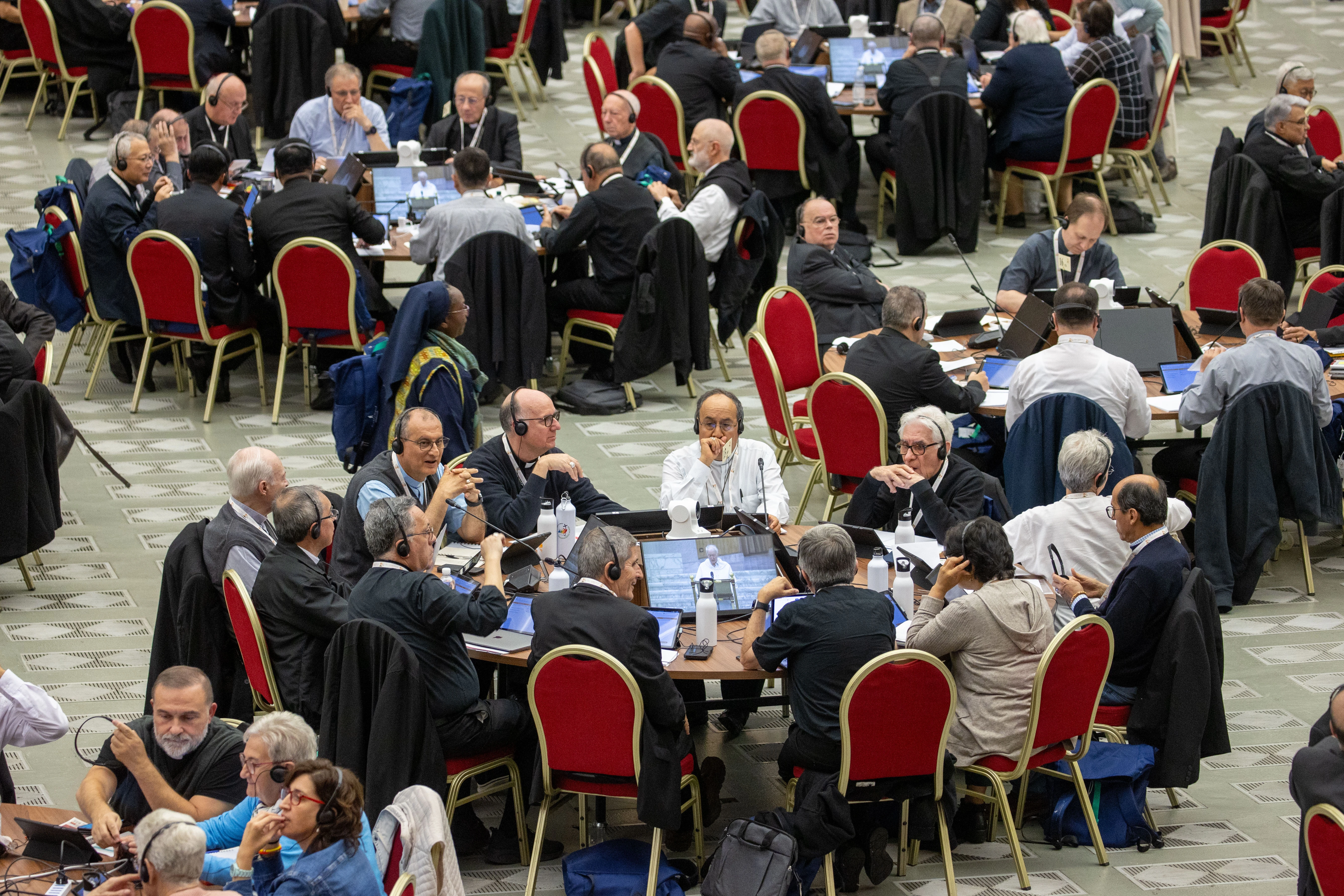 Delegates at the 2024 Synod on Synodality participate in roundtable meetings on Oct. 10, 2024, in the Paul VI Hall at the Vatican.?w=200&h=150