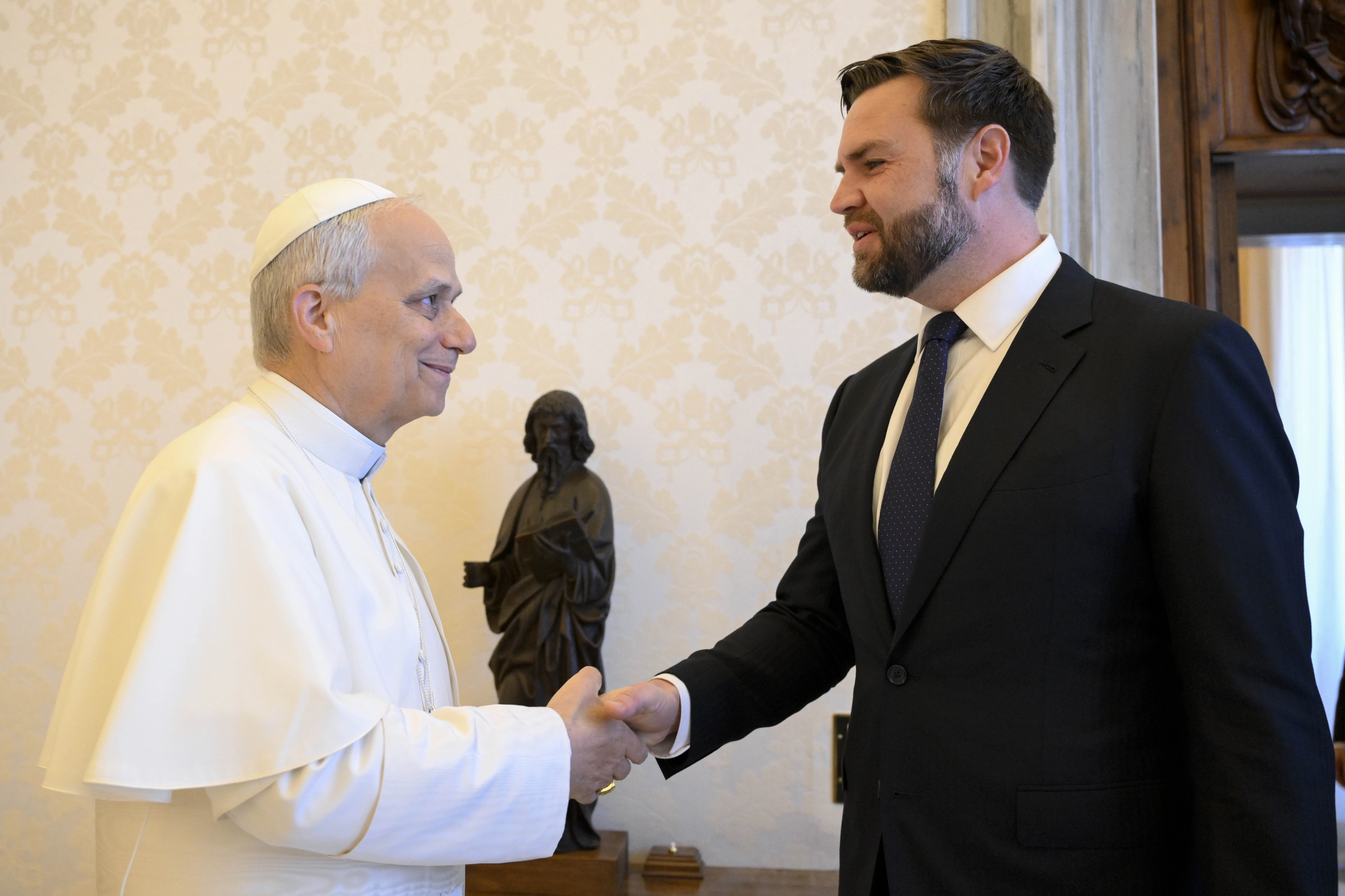 Pope Leo XIV shakes hands with U.S. President JD Vance in the papal library. The two had a private encounter before they were joined by U.S. Secretary of State Marco Rubio on May 19, 2025.?w=200&h=150