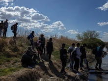 Approximately 200 Venezuelan migrants cross the Rio Grande seeking to surrender to the Border Patrol in their pursuit of humanitarian asylum on March 31, 2023.