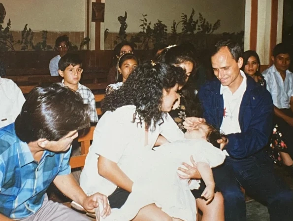 Father Robert Prevost at Mildred's baptism. Credit: Courtesy of Mildred Camacho