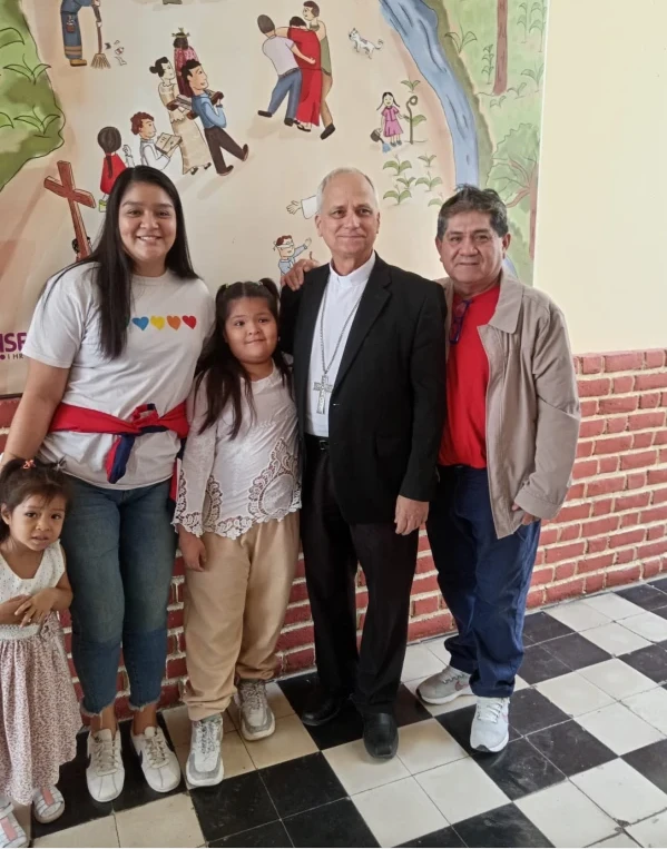 Mildred with her two daughters, Bishop Robert Prevost — now Pope Leo XIV — and Héctor Camacho. Credit: Courtesy of Mildred Camacho