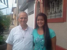 Mildred, the Peruvian goddaughter of Pope Leo XIV, with then-Father Robert Prevost.